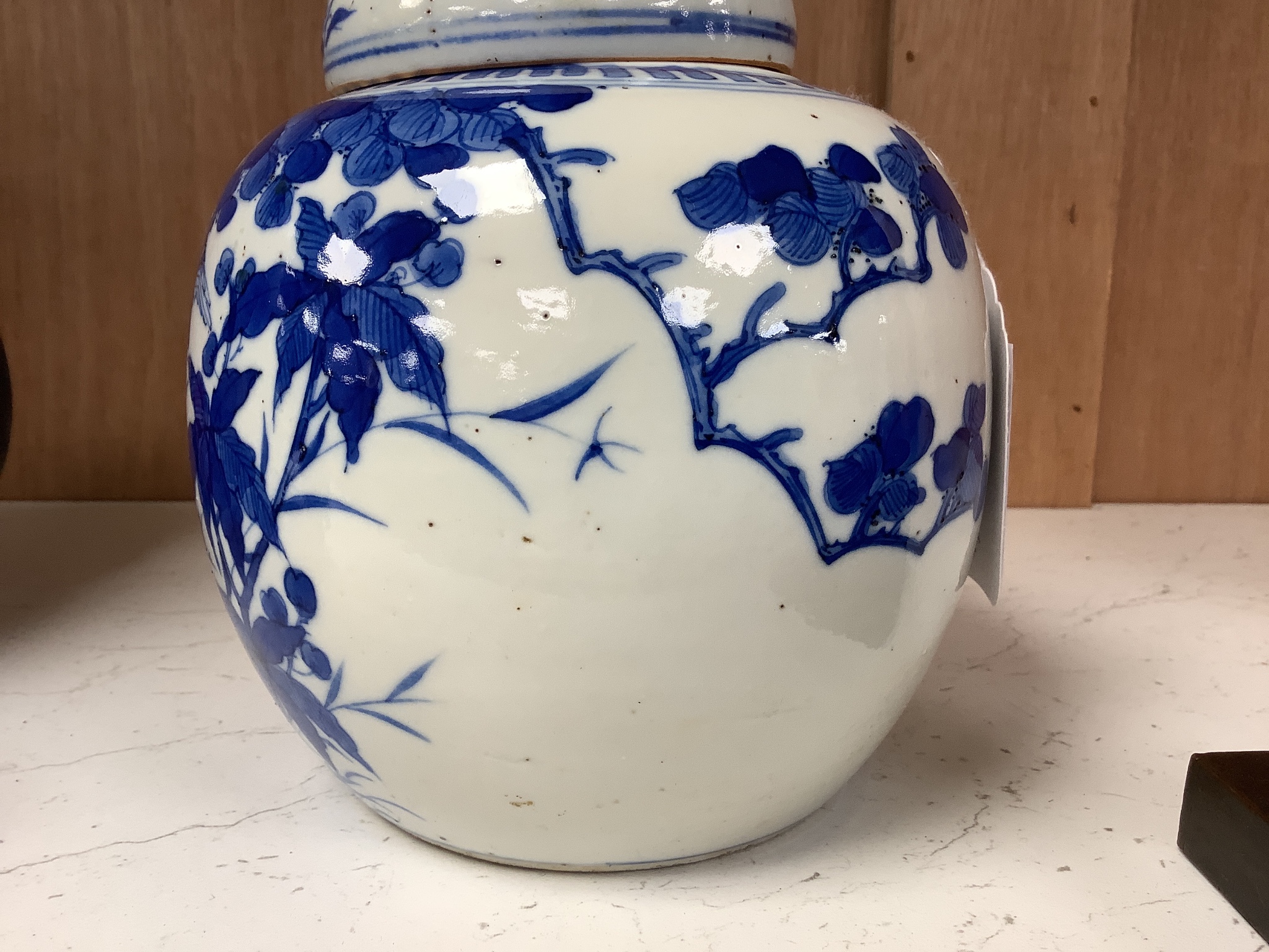 A Chinese blue and white 'birds and flowers' jar and cover, Kangxi mark, c.1900, height 15cm